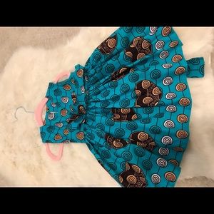 Baby girl tribal dress in green with pleated belt